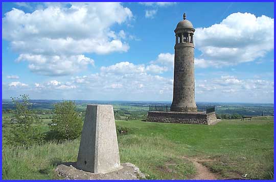 A trig point behind the monument.