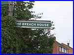 The Breach House sign